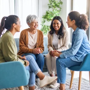 diverse group of women smiling and sharing experie