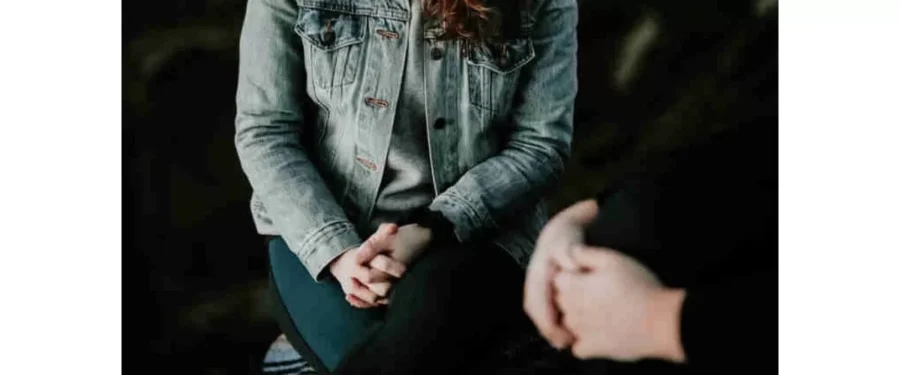 woman with clasped hands