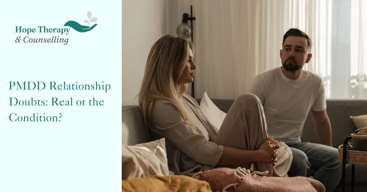 A couple sitting in thought, representing the experience of PMDD relationship doubts and the uncertainty they bring